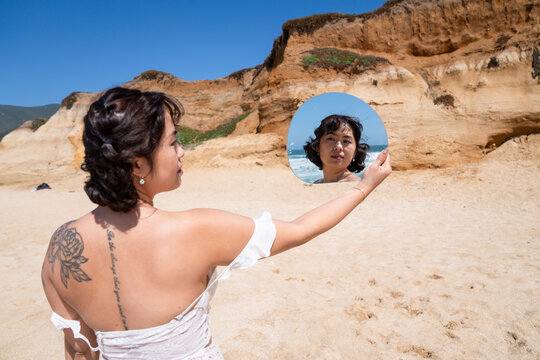 Posing for portrait reflected on mirror