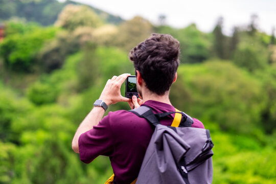 Male tourist on the hill in Kyoto, Japan