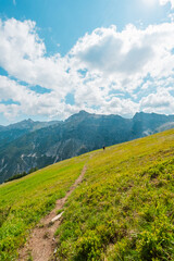 Paraglider with Backpack Walking Up the Hill to Departure Flying Spot