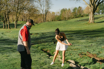  young happy people   playing golf in the morning sun 