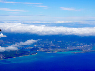 Aerial View of Oahu Airport and Pearl Harbor With Clouds and a Plane