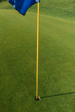 flag showing a hole on a golf course 