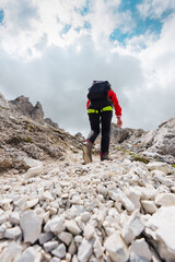 Climber Hiking Up a Mountain Path Made of Gravel Stones