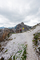 Fototapeta premium Hiker Standing on the Fork of a Mountain Path