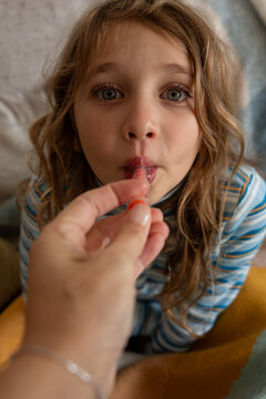 A sick child getting medicine