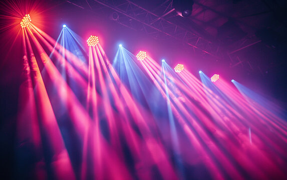 A stage lit with numerous bright, colorful lights, creating a vibrant and energetic atmosphere