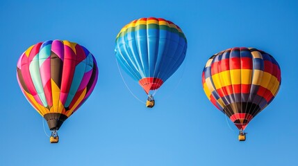 Fototapeta premium Vibrant Hot Air Balloons Soaring in Clear Blue Sky - Colorful Balloon Festival Adventure and Travel Concept
