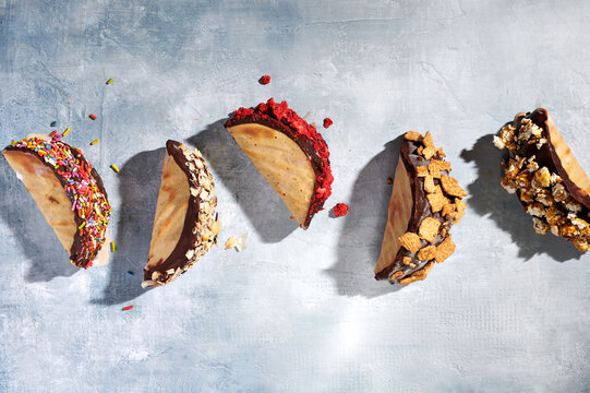 A Row of Choco Tacos with Various Toppings