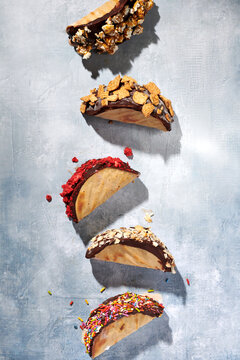 A Row of Choco Tacos with Various Toppings