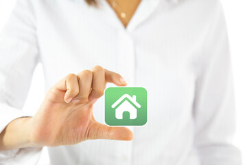 Real estate concept businesswoman touching a house icon. Property insurance and security concept