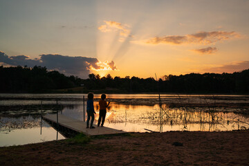 Lakeside Sunset Silhouettes