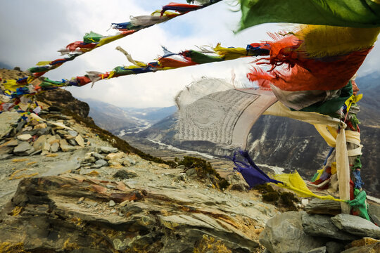 Colorful Prayer Flags Fluttering on a Mountain Pass