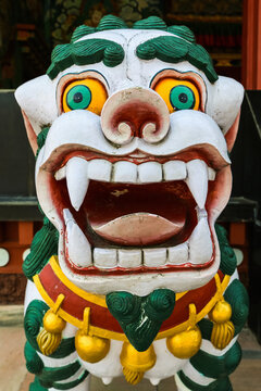 Traditional statue of a temple guardian in bright colors