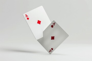 Obraz premium A pair of playing cards falling through the air