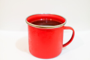 Iron Red cup of coffe isolated above white background with copy space,caffein, stock drink.
