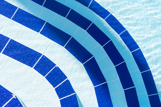 Curved Pool Steps in Sunlit Water.