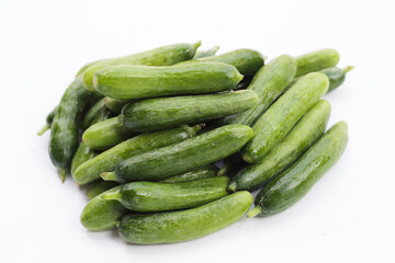 Mini cucumbers on white background.