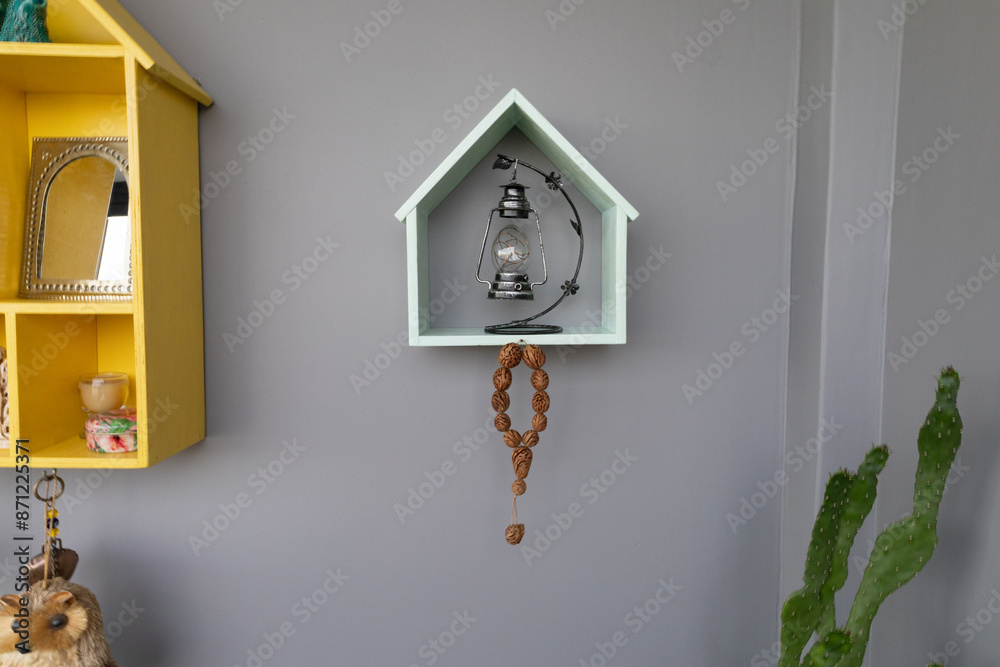 Wall mural decorative wall shelves with lantern and ornaments in a cozy home setting