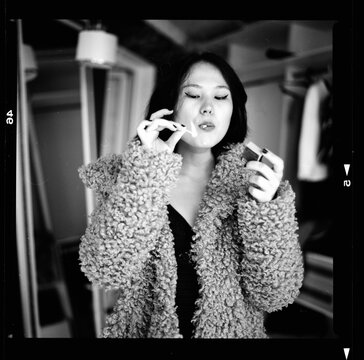 Woman lighting up a cigarette