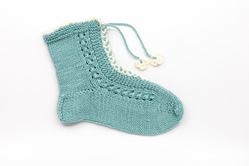 Hand-Knitted Light Blue Woolen Sock with Floral Detail and Lacing