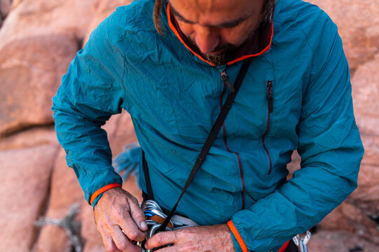 Rock climber organizing gear, weekend adventure
