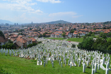 SARAJEVO, BOSNIA - August 02, 2014: Martyrs’ memorial muslim cemetery in Sarajevo. The graveyard is hosting a 90% of tombstones from 1992-1995. Aliya izzetbegovic graveyard is in this graveyard