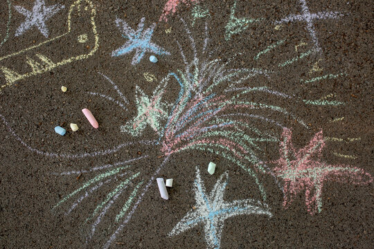 boy drawing crayons outdoor