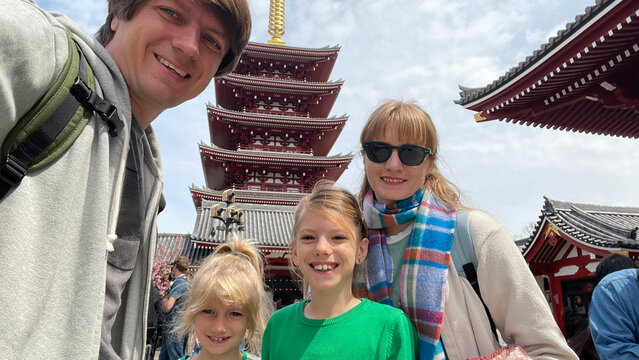 Selfie of a family outdoors with daughters in Tokyo