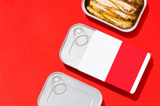 Canned sardines mockup flat lay on red background