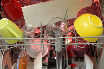 Open dishwasher Clean mugs plates