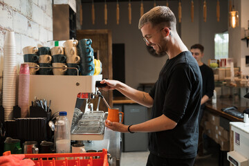 Barista preparing coffee in a modern cafe