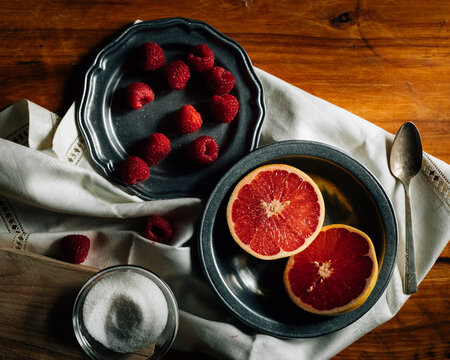 still life with grapefruit and rasberries