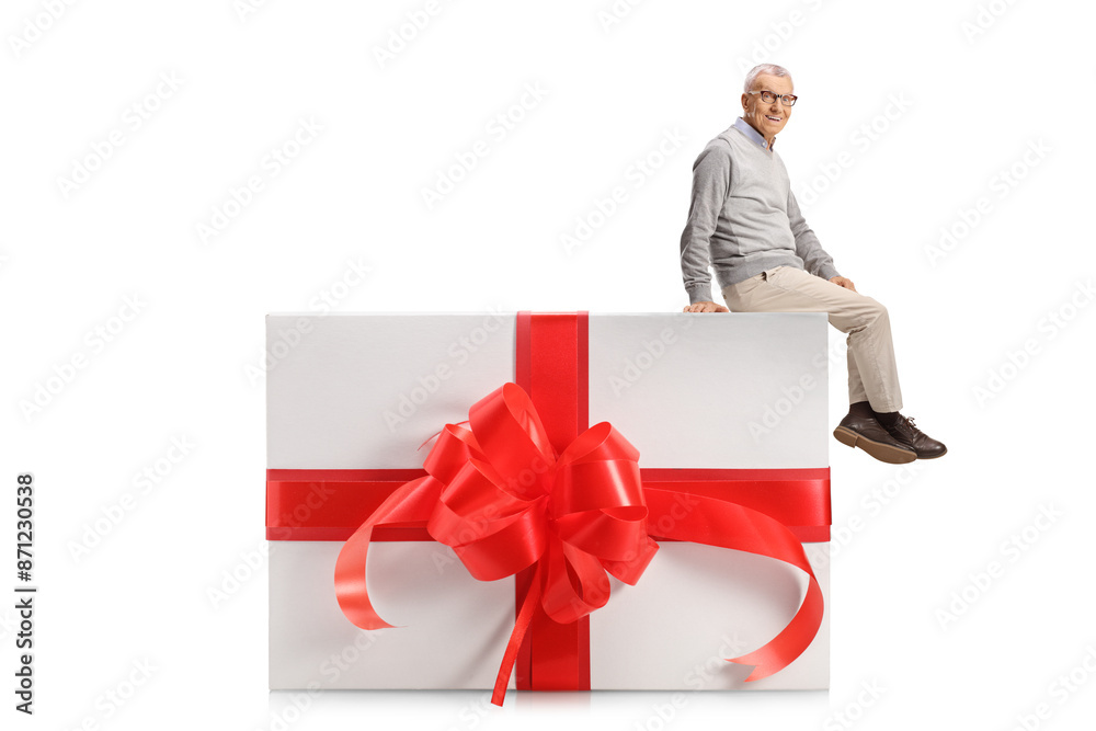 Sticker elderly man sitting on a big gift box