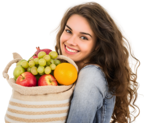 Portrait of happy smiling young beautiful woman holding a bag full of various different fruits, isolated on a transparent background. Supermarket grocery shopping, girl healthy retail store food buy