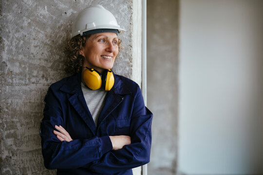 Confident female worker in industrial site