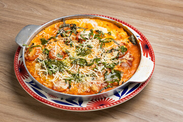 Neapolitan Eggs for breakfast - Eggs, grated tomatoes, parmesan, tomato paste and toast.