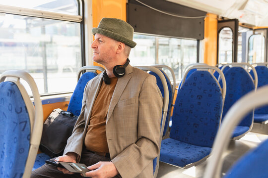 Middle age man travelling in public transport
