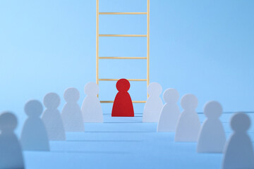 Leadership concept with businessman paper cut near ladder among