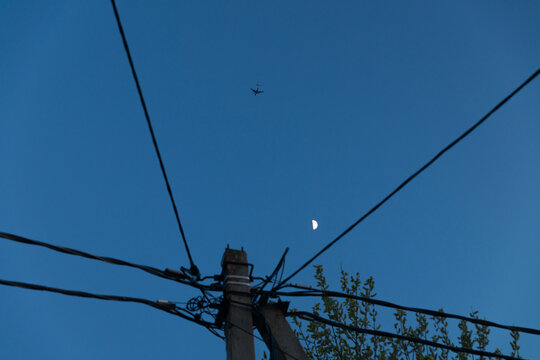 Traveling Plane In Twilight Clear Sky With Moon
