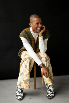 Happy queer fashion man in studio
