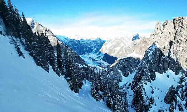 The camera seamlessly flies over a vast snowy mountain made with Ai generative technology