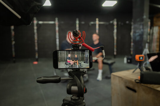 Behind-the-scenes fitness vlogging setup in gym