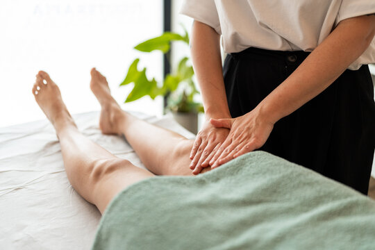 Manual lymphatic drainage in legs.