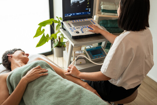 Physiotherapist doing an ultrasound.