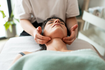 Close-up of woman receiving massage.
