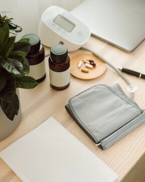 Still life with pills and tablets, notebook and  tonometer