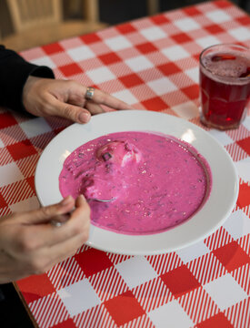Anonymous woman eating chlodnik 