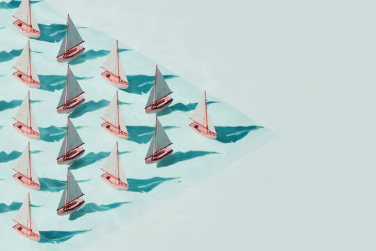 Sailboats in Diagonal Rows on Blue Water