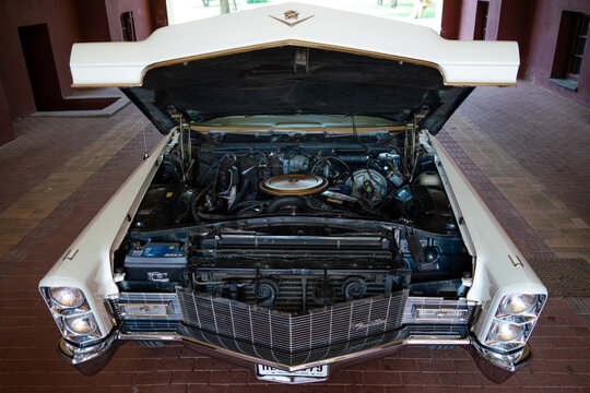 Open hood and v8 engine 472 cu in (7,730 cc) of Cadillac De Ville 1968 (third generation 1965&ndash;1970) - Palic, Serbia, 30.06.2024