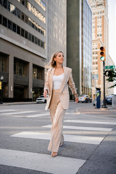 A woman walks down a city street